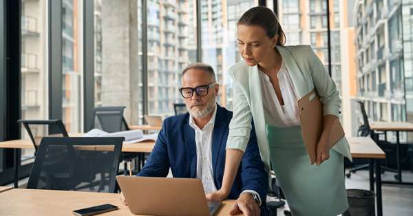 Colleagues working in their large office space