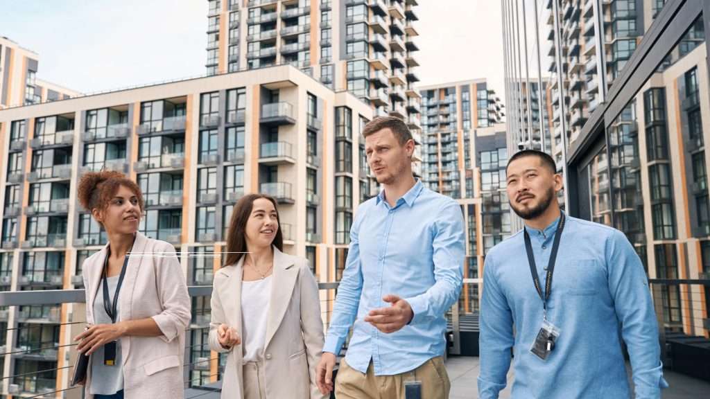 a group of people walking in front of a building